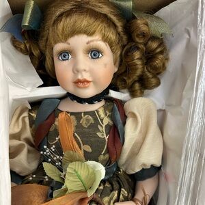 Elegant Porcelain Doll with Curly Hair